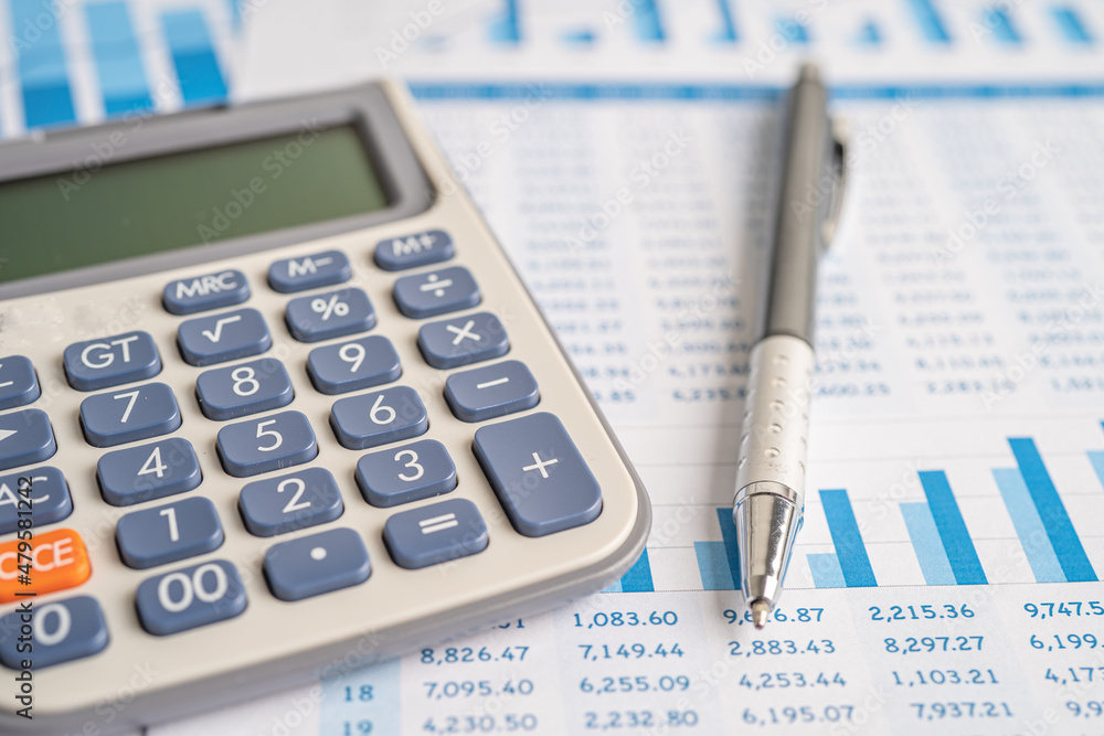 Calculator on graph paper. Finance development, Banking Account, Statistics, Investment Analytic research data economy, Stock exchange trading, Business company concept. Calculator on graph paper. Finance development, Banking Account, Statistics, Investment Analytic research data economy, Stock exchange trading, Business company concept.