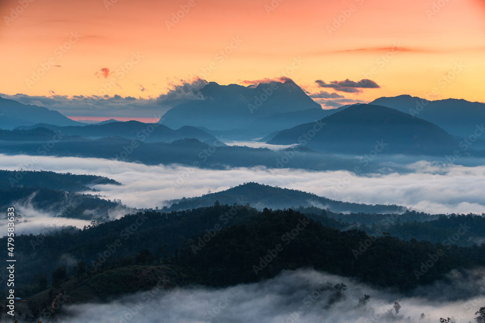 Sunrise over Doi Luang Chiang Dao mountain and foggy on hill in national park at Den TV viewpoint