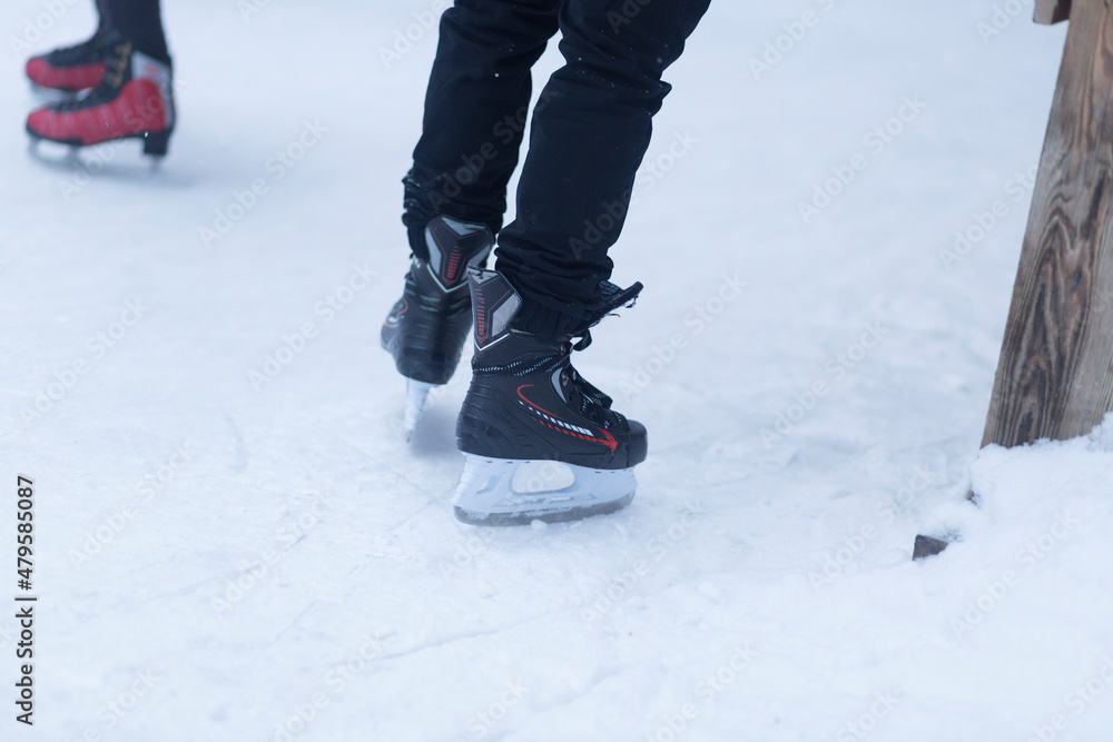 People skate in winter. A special skating rink for ice skating. People skate in winter. A special skating rink for ice skating.