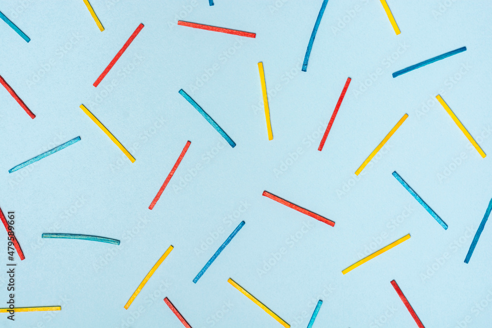 Colorfull wooden sticks on a blue background Colorfull wooden sticks on a blue background