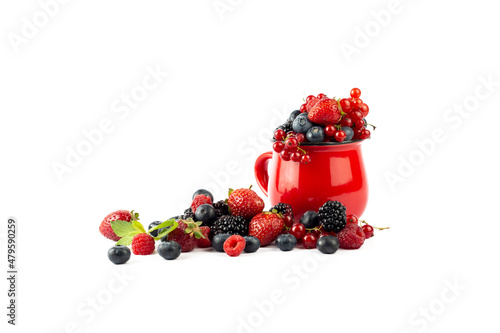 Berries. Ripe berries mixed assortment in red cup on white background. Summer or Spring Organic Berry background.