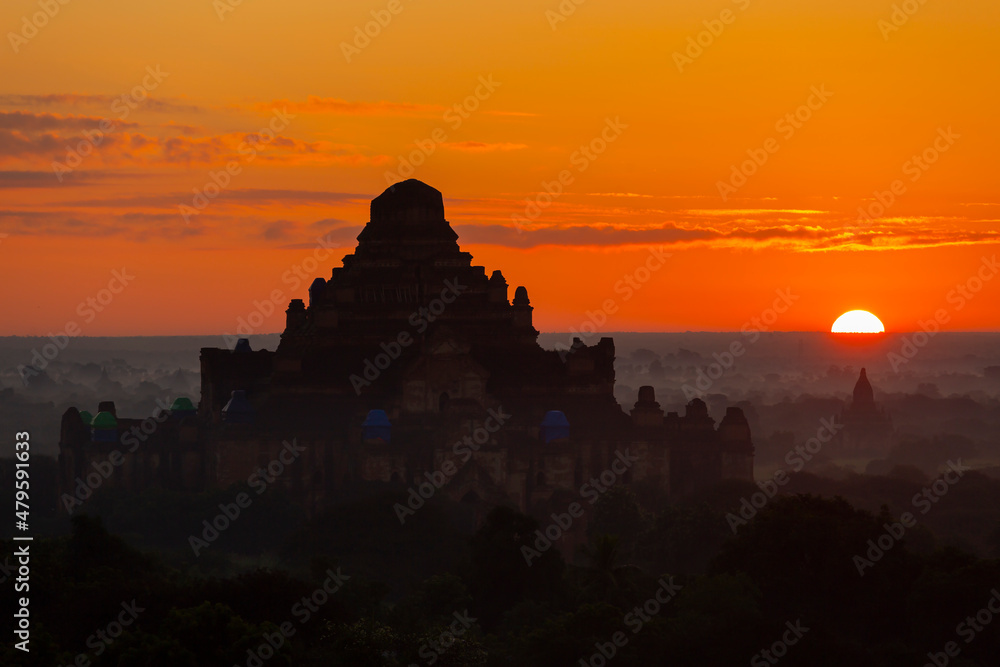 group of ancient pagodas in Bagan at the sun set, myanmar
