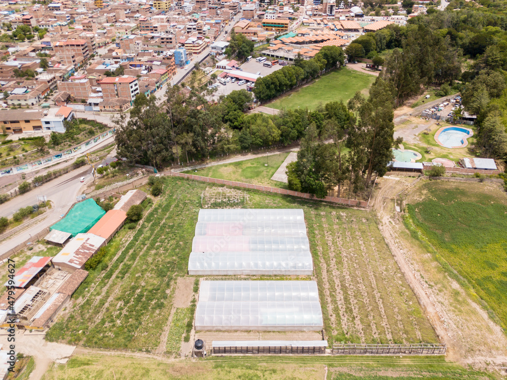 Aerial view of a greenhouse in rural side of Urubamba Cusco. Agriculture technology in Sacred Valley in Peru.