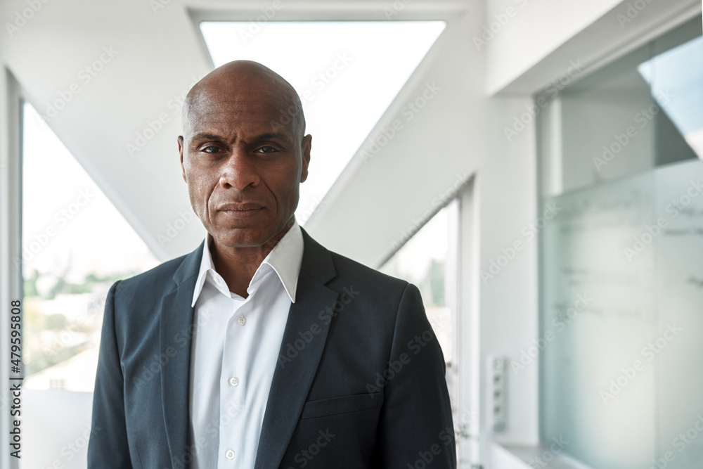 Confident black male businessman looking at camera Confident black male businessman looking at camera