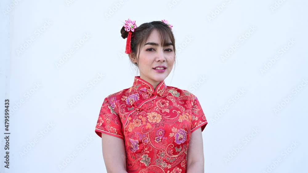 Portrait beautiful asian woman in Cheongsam dress on white background,Thailand people,Happy Chinese new year concept,Happy asian lady in chinese traditional dress Portrait beautiful asian woman in Cheongsam dress on white background,Thailand people,Happy Chinese new year concept,Happy asian lady in chinese traditional dress