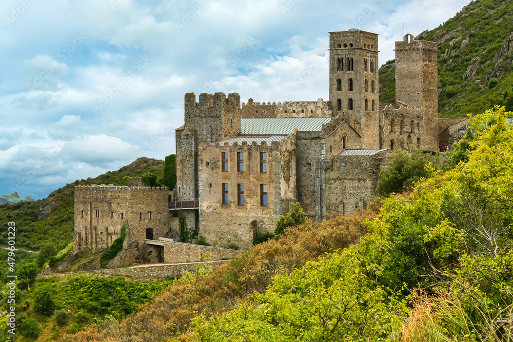 Medieval monastery on the mountain with high stone towers. Sant Pere de Rodes, Girona.