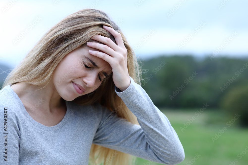 Teenage girl complaining suffering head ache