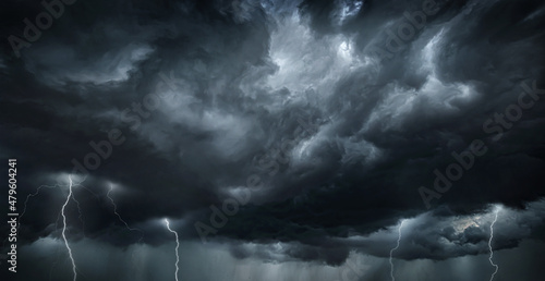 Fotografija Thunderous dark sky with black clouds and flashing lightning