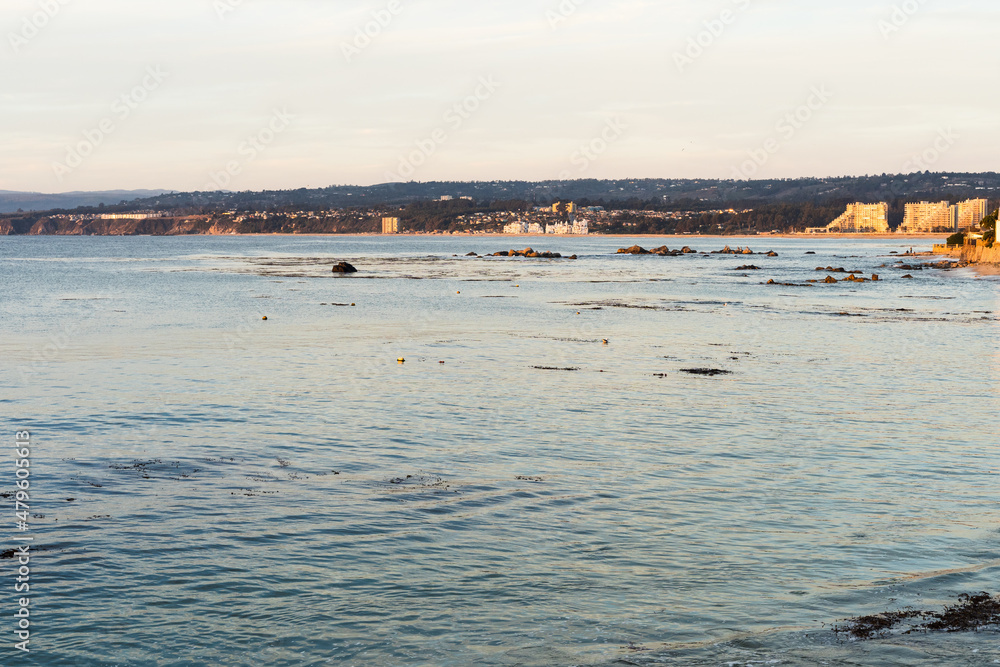 Smooth sea at sunset in Algarrobo beach, Chile. Tourist destination, summer holidays concepts Smooth sea at sunset in Algarrobo beach, Chile. Tourist destination, summer holidays concepts