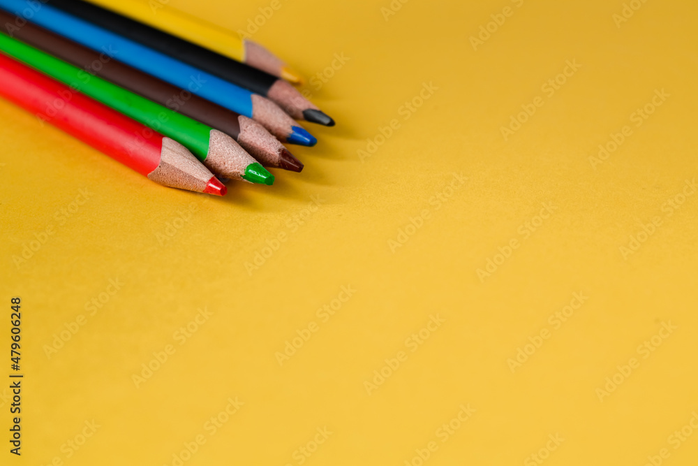 Set of colored pencils on a yellow background. Copy space. Set of colored pencils on a yellow background. Copy space.