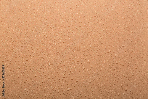 Water drops on coral color  surface
