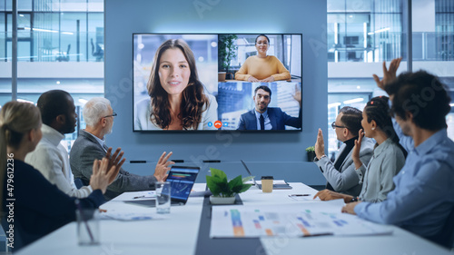 Obraz na plátně Video Conference Call in Office Boardroom Meeting Room: Executive Directors Talk with Group of Multi-Ethnic Entrepreneurs, Managers, Investors