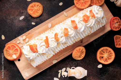 Meringue zesty roulade. Orange Meringue roll cake with orange custard. 