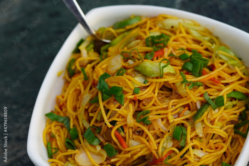 Vegetable Hakka Noodles or ChowMein in white bowl Vegetable Hakka Noodles or ChowMein in white bowl