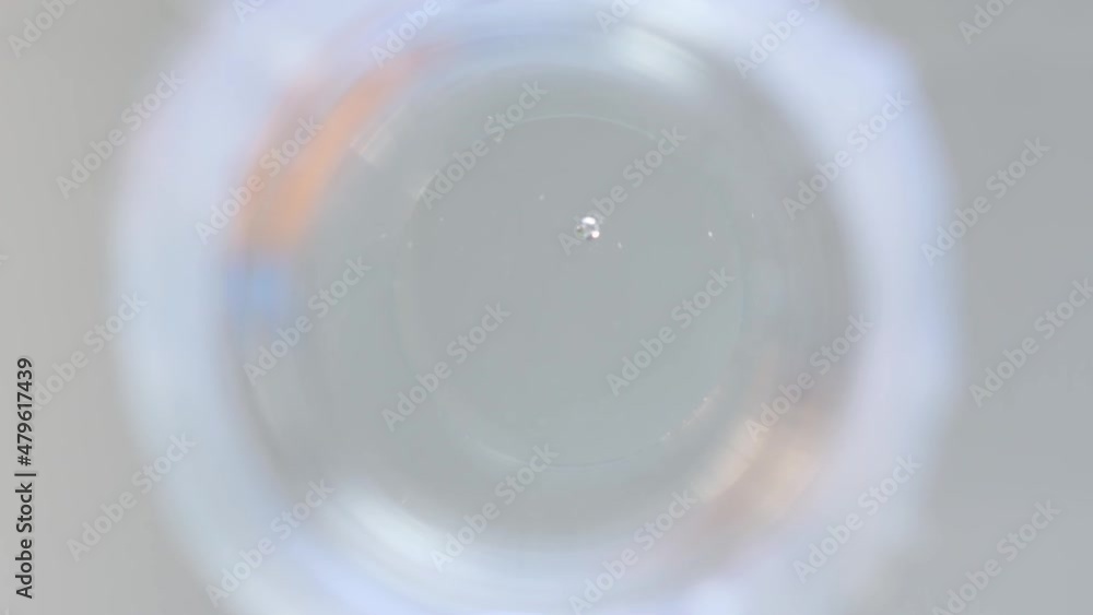 View from below of blue chemical test. Selective focus. View from below of blue chemical test. Selective focus.