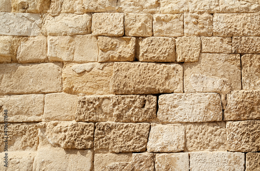 Fototapeta premium Old beige stone wall background texture