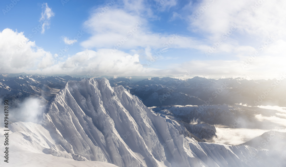 Aerial Panoramic View of Canadian Mountain covered in snow. Winter Season Cloudy Day Art Render. Located near Squamish, North of Vancouver, British Columbia, Canada. Nature Background Panorama