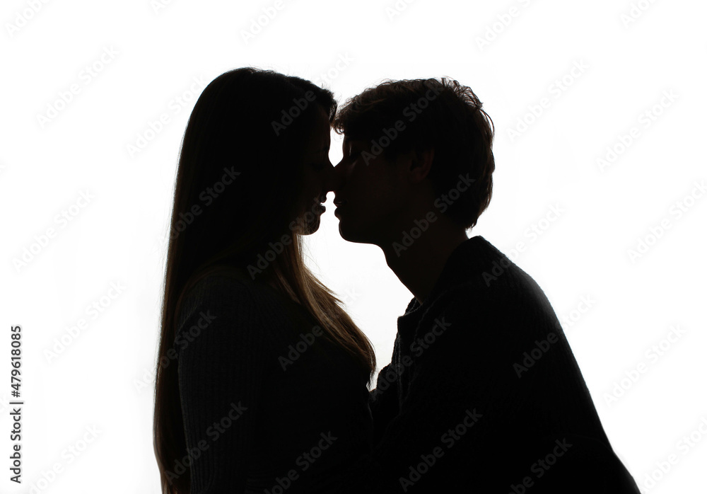 silhouette of kissing heterosexual couple white background