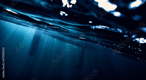 Obraz na plátně yacht under water in the rays of the sun