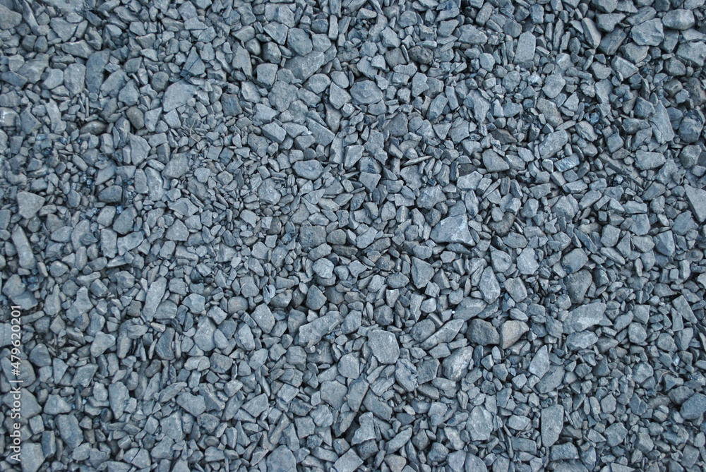 Gravel path in the park. Fine pebbles. An alley in the garden. An interesting pattern for wallpaper, background. Gravel path in the park. Fine pebbles. An alley in the garden. An interesting pattern for wallpaper, background.