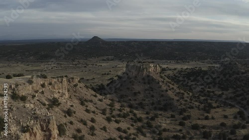 Flying over mounds of dirt and rock in New Mexico