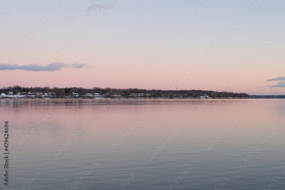 Pink sunset on Niagara River winter evening