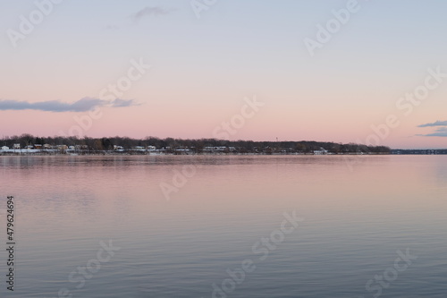 Pink sunset on Niagara River winter evening © Serg