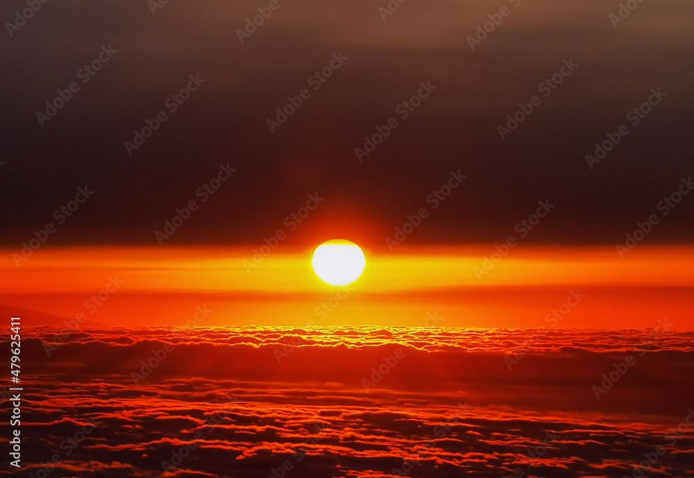 sunset over the clouds sea 
