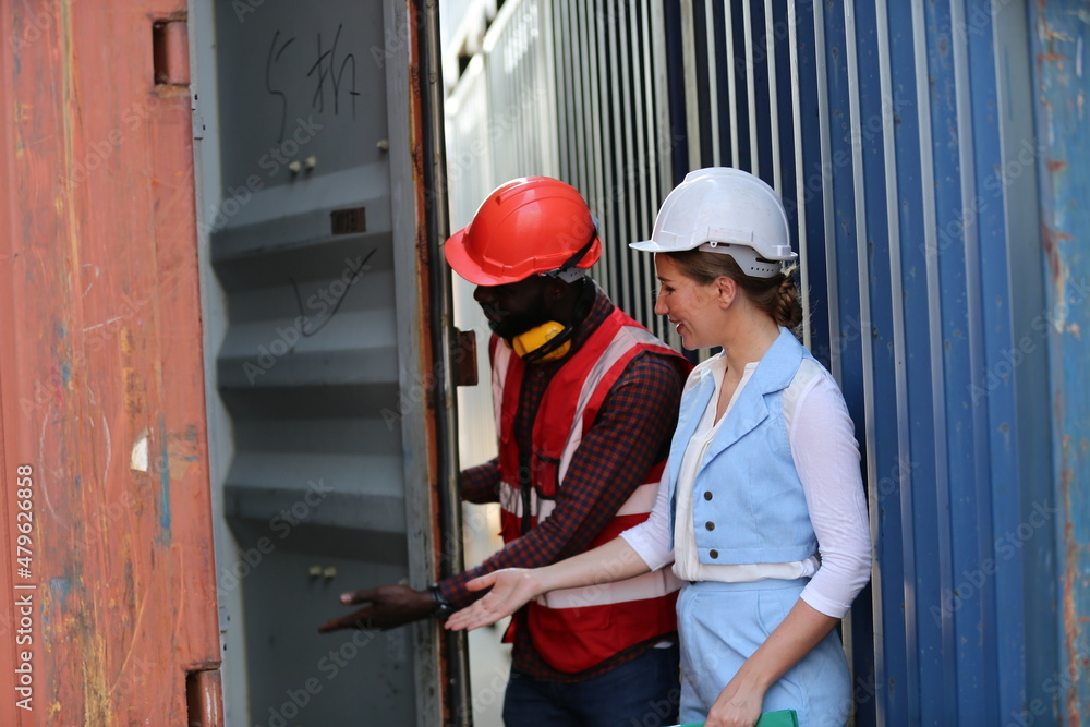 Foreman control loading Containers box from Cargo freight ship for import export. Freight containers in sea port. Foreman control loading Containers box from Cargo freight ship for import export. Freight containers in sea port.