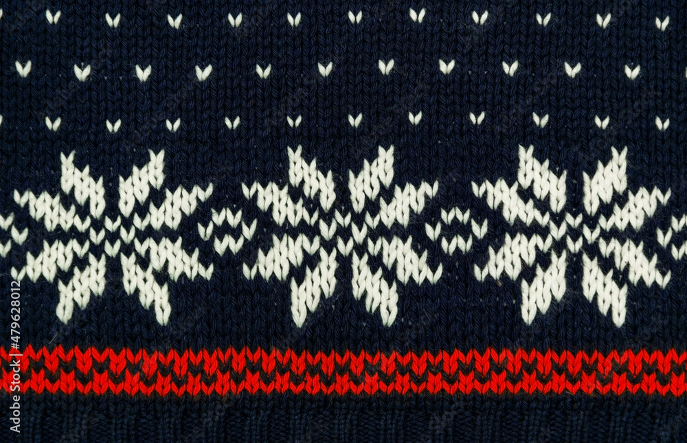 Traditional knitted blue sweater with snowflakes Traditional knitted blue sweater with snowflakes