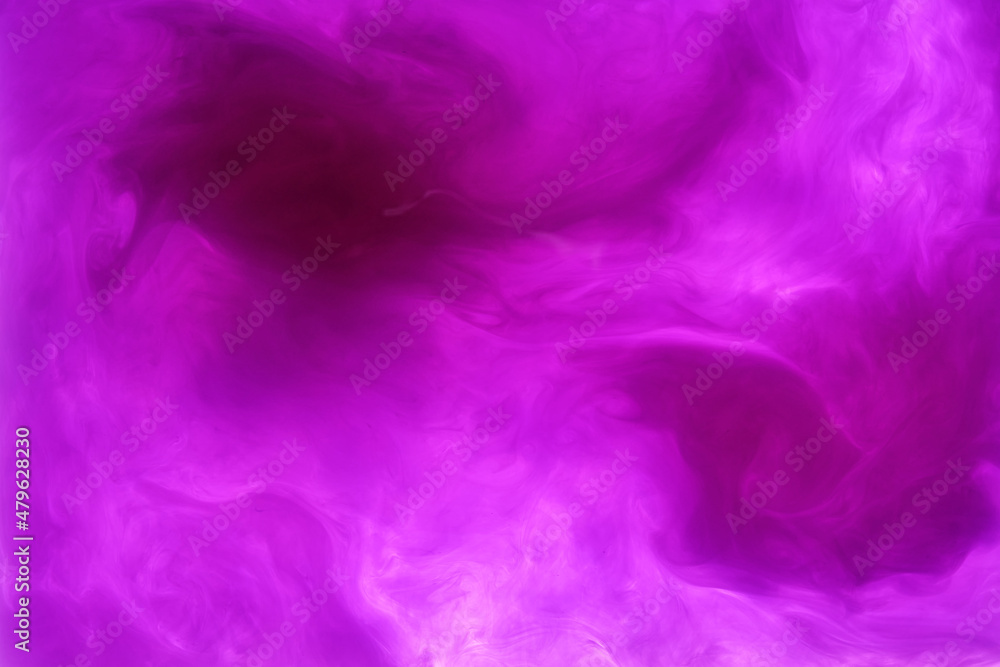 purple acrylic ink making shapes in the water