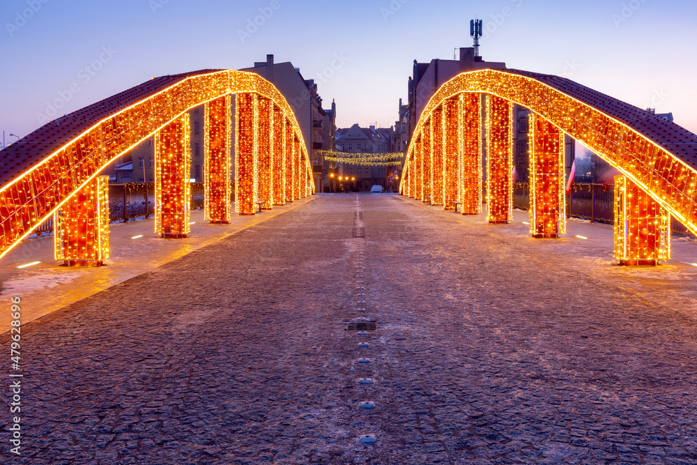 Fototapeta premium Poznan. The Bishop Jordan Bridge in the early morning festive illumination.