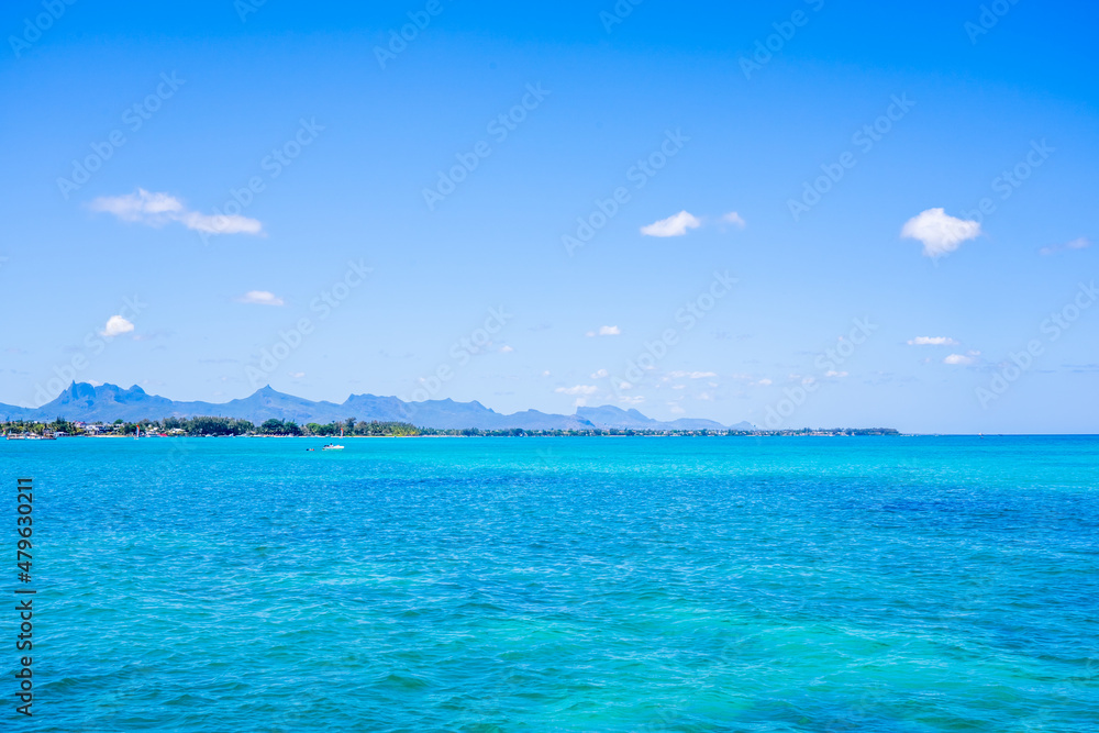 Mauritius Island, sea water and island mountains view. Turquoise water, tropical vacance. High quality photo