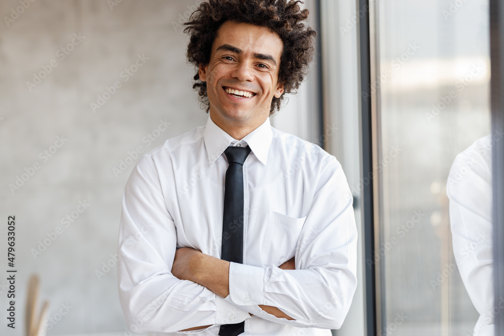 Fototapeta premium Corporate portrait of successful young black businessman at the office.