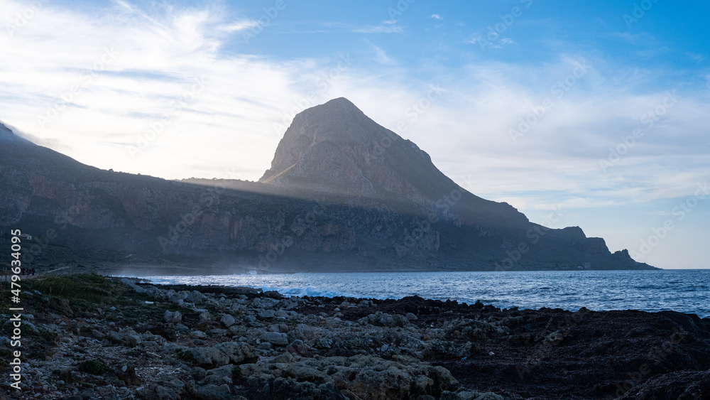 Sunset view of Monte Cofano with beach and sea. San Vito Lo Capo, Macari, Sicily, Italy. Sunset view of Monte Cofano with beach and sea. San Vito Lo Capo, Macari, Sicily, Italy.