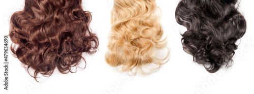 Obraz na plátně Brown, blonde and black hair on white background