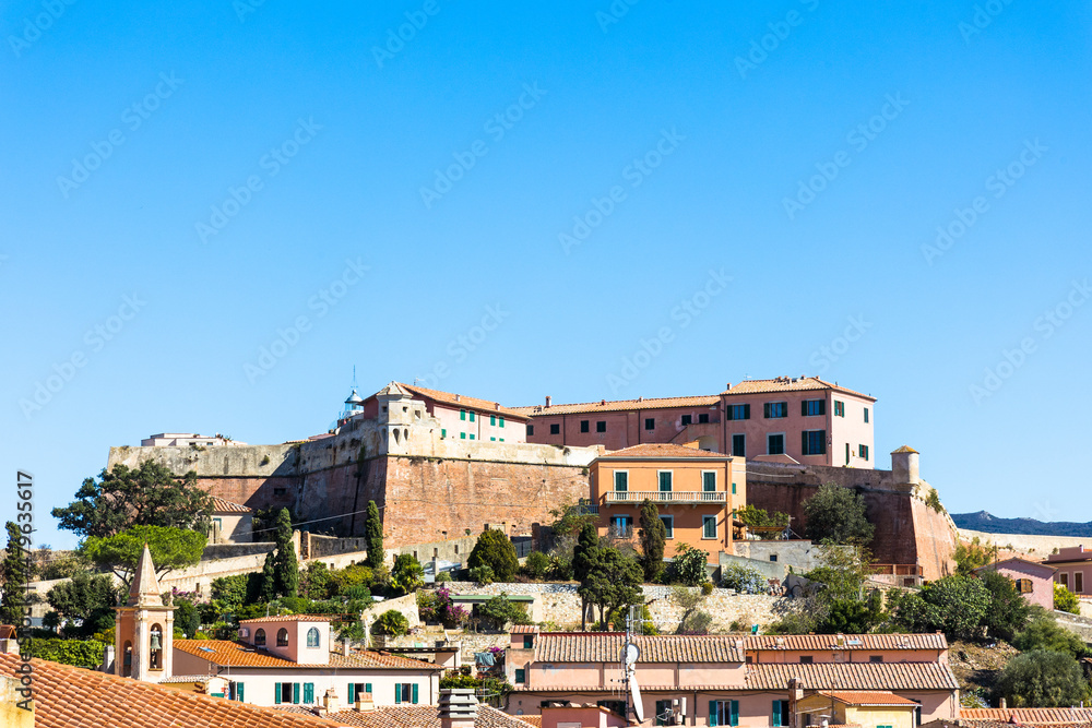 View over the island capital Portoferraio on the island of Elba in Italy under a bright blue sky in summer