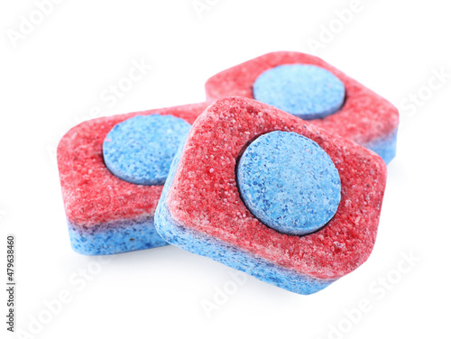 Many dishwasher detergent tablets on white background