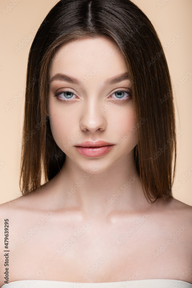 close up of brunette young woman isolated on beige close up of brunette young woman isolated on beige