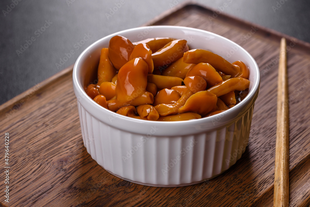 Homemade pickled honey agarics mushrooms in a white bowl Homemade pickled honey agarics mushrooms in a white bowl