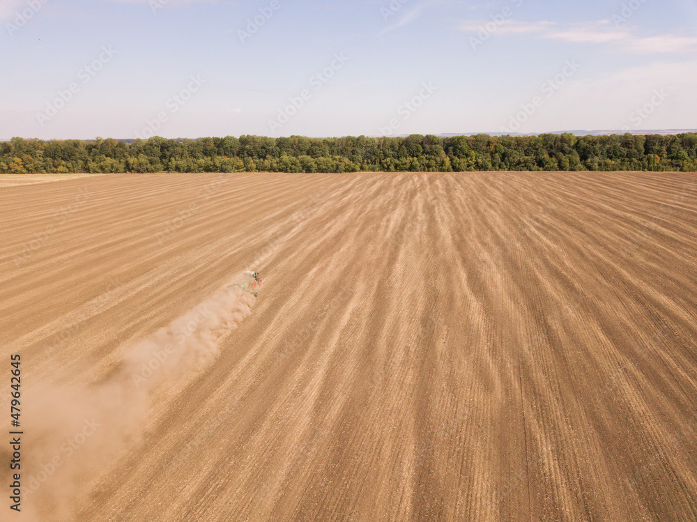 Aerial view of Harvesting in the Golden Wheat Field