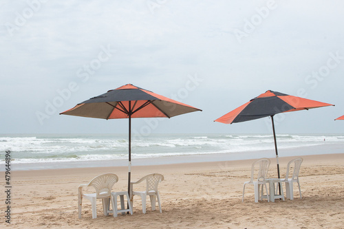 beautiful landscape with beach chair and a parasol on a sunny day.