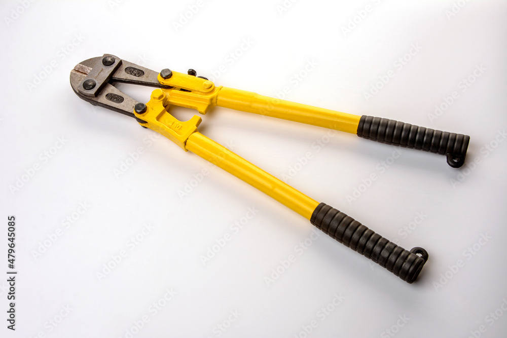 Bolt cutter on concrete surface construction concept.hardware store and manual work tools concept with boltcutter Bolt cutter on concrete surface construction concept.hardware store and manual work tools concept with boltcutter