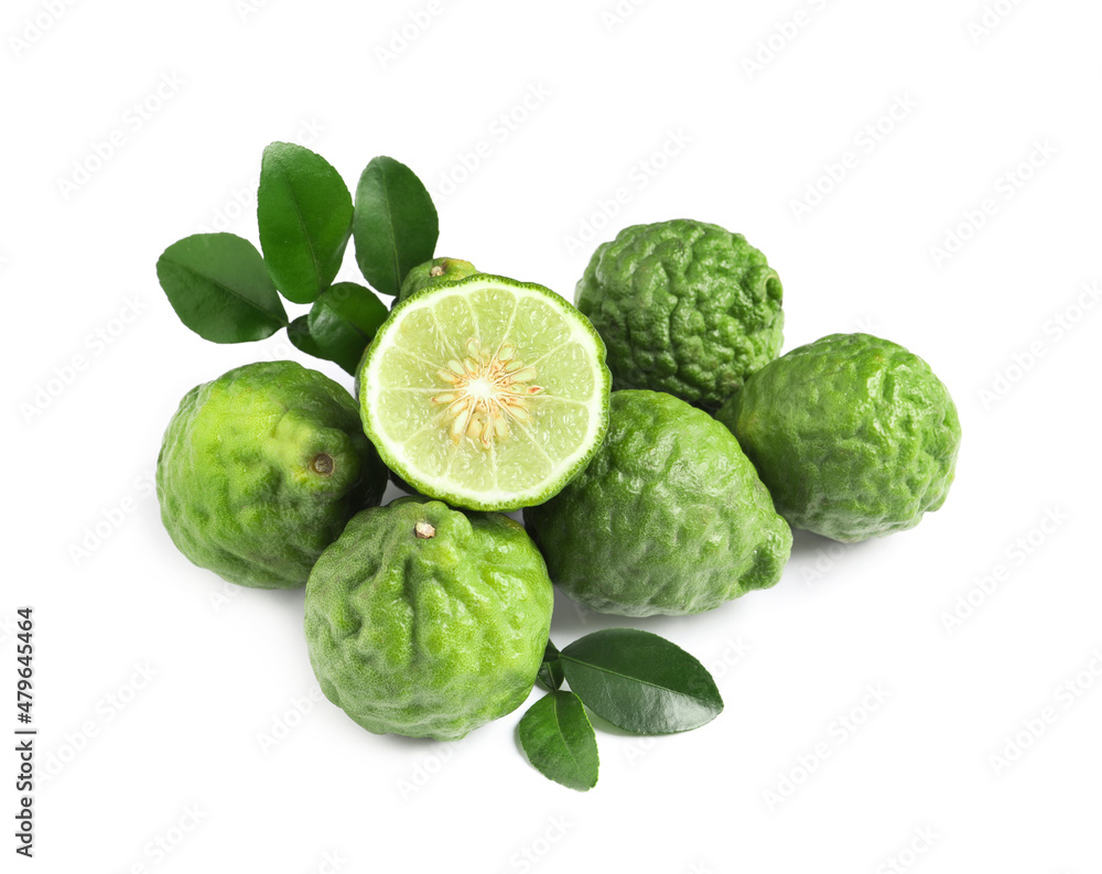 Fototapeta premium Fresh ripe bergamot fruits and green leaves on white background, above view