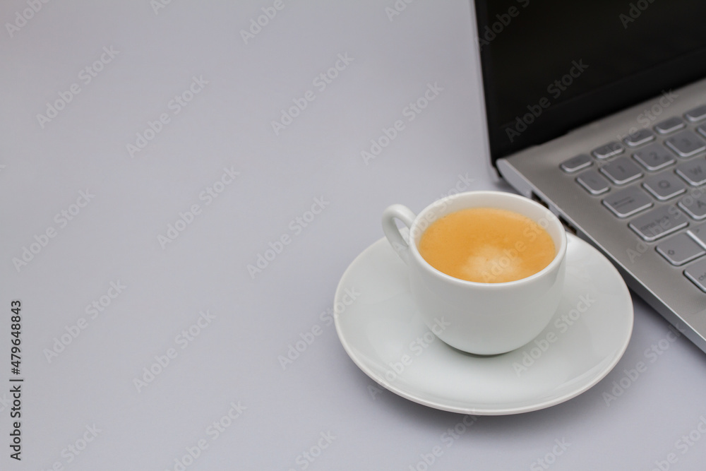 cup of coffee with computer