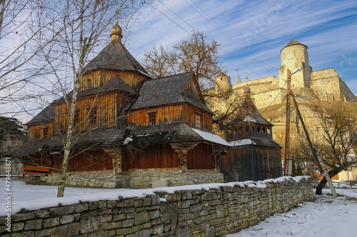 Old wooden church in Kamianets-Podilskyi, Ukraine at sunny winter day