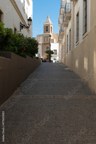 View of the bell tower of Our Lady of the O church from the wall gate Portillo del Sur, Rota, Cadiz, Andalusia, Spain