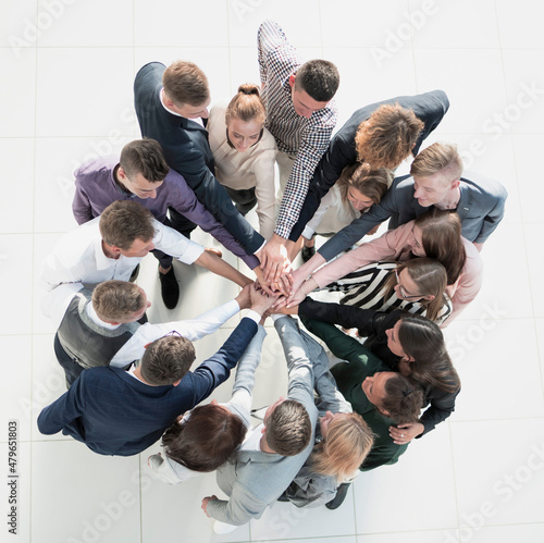 top view. group of young business people showing their unity