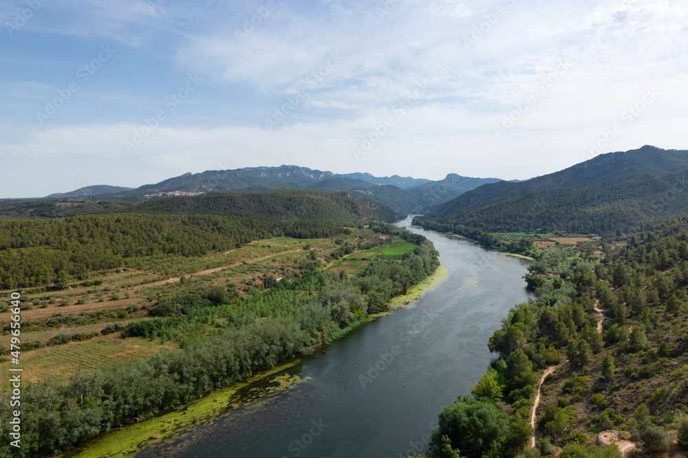 View of the Ebro river as it passes through the municipality of Miravet. Tarragona, Spain. Landscape and nature.