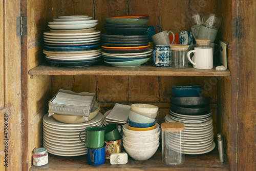 Old furniture with plates and bowls.